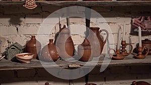 Potter`s hands shaping up the terracotta clay pot on wheal.