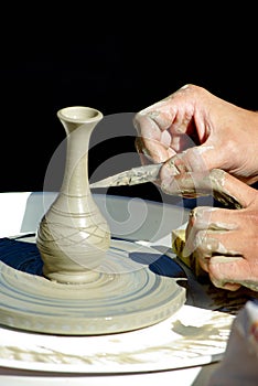 Potter's hands at work