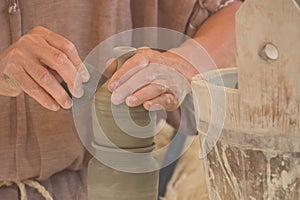 Potter's hands at work