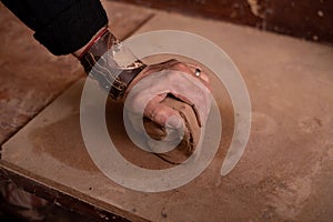 Potter`s hands work with clay