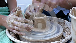 Potter`s Hands Work with Clay on a Potter`s Wheel. Slow Motion