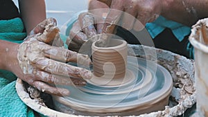 Potter`s Hands Work with Clay on a Potter`s Wheel. Slow Motion