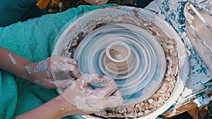 Potter`s Hands Work with Clay on a Potter`s Wheel. Slow Motion