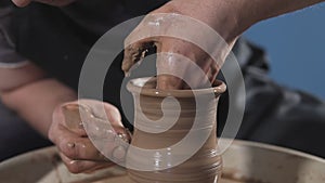 Potter`s work close-up. Man hands making clay jug. Handmade. Craft.