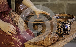 Potter shaping the clay