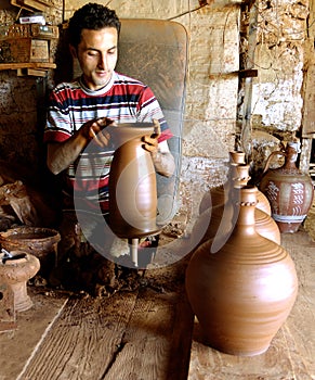 The potter working
