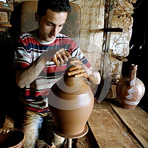 The potter working
