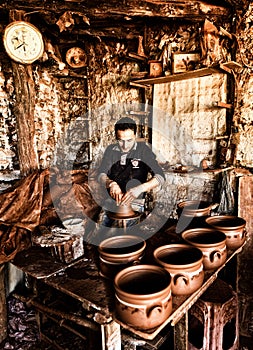 The potter working