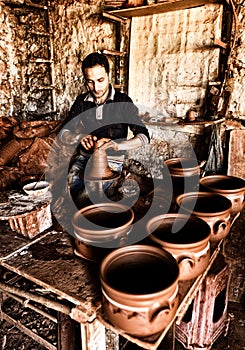 The potter working