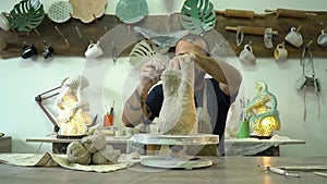 Potter working in the pottery working place. Time lapse