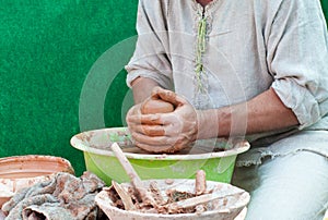 Potter works. Crockery creation process in pottery on potters' w