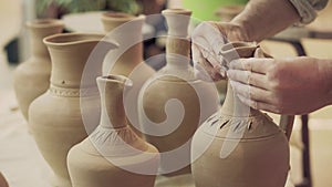Potter works. Crockery creation process in pottery on potters wheel