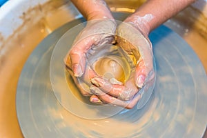 Pottering - creating a clay cup in process