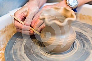 Pottering - creating a clay cup in process