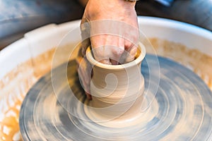 Pottering - creating a clay cup in process