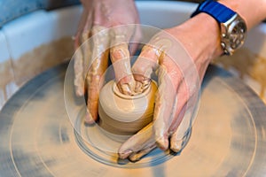 Pottering - creating a clay cup in process