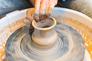 Pottering - creating a clay cup in process