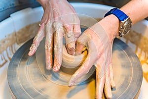 Pottering - creating a clay cup in process