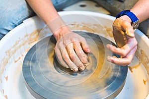 Pottering - creating a clay cup in process