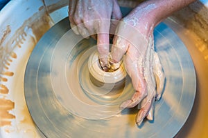 Pottering - creating a clay cup in process