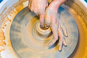 Pottering - creating a clay cup in process