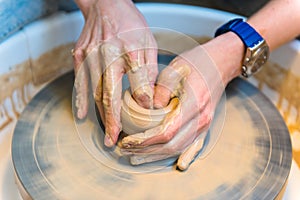 Pottering - creating a clay cup in process