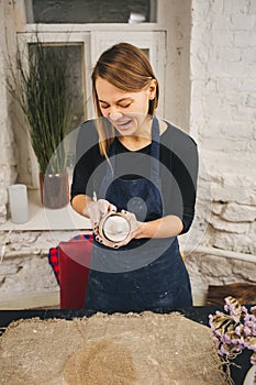 Pottering process.Dirty hands creating dishes