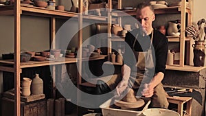 Pottery craft talented male artist preparing clay