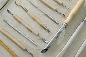 Pottery craft tools for sculpting clay art. View from above.