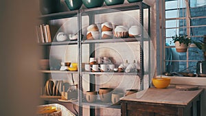 Pottery, creativity and ceramics on shelf in a store, workshop or studio for manufacturing display. Art, handicraft and