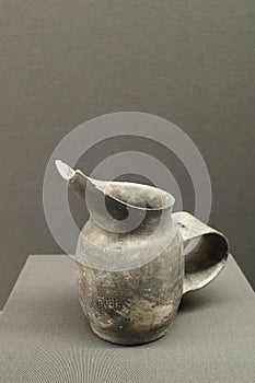 Pottery Ewer with a Wide Handle and Finely Incised Pattern