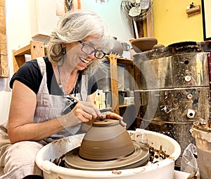 Pottery is a favorite pastime and relaxation Pleasure and joy Beautiful adult explored her woman sculpts a vase from