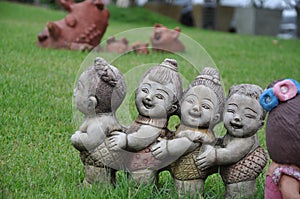 Pottery figurine on the grass
