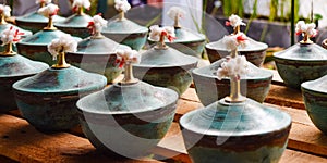 Pottery with lids on the wooden table