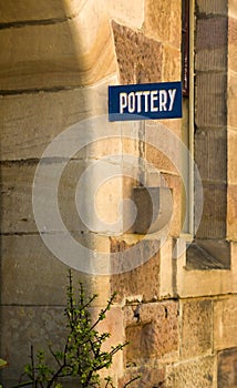 Pottery sign Sandstone wall Old Building detail