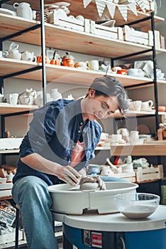 Pottery skill, woman ceramist works on potter& x27;s wheel