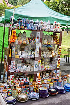 Pottery stall with different merchandise on a fair