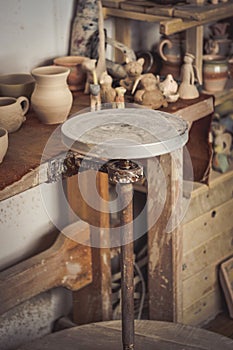 Pottery studio, empty potter`s wheel, pottery from clay