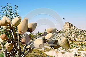 Pottery tree in front of Uchisar Castle in Cappadocia, Turkey