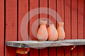 Pottery vases on shelf.