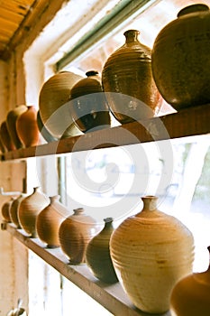 Pottery vases on shelf
