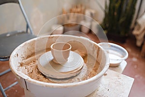 Pottery wheel with clay pot, nobody