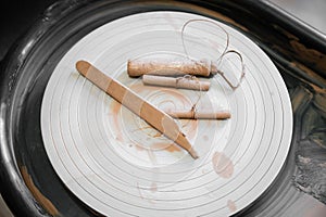 pottery, workshop, ceramics art concept . Close up view of string cutter and pottery tools