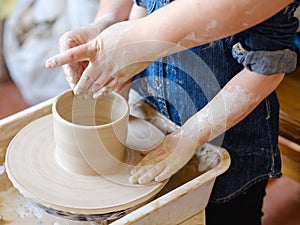 Pottery workshop craft artisan teach child clay