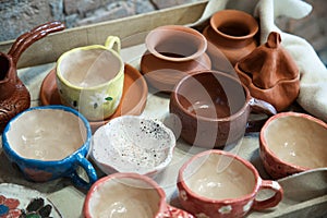 Pottery workshop with crockery . Clay products collection at workshop