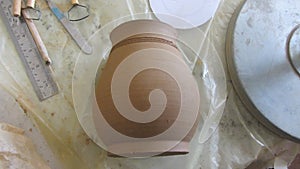 Pottery Workshop Table with Unfired Clay Pot