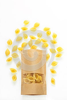 Pouch bag with pasta flatlay, top view. Packaging with transparent window isolated on white background