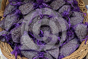 Pouch with lavender in a wooden basket. Fragrant bag of lavender flowers