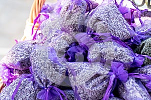 Pouch with lavender in a wooden basket. Fragrant bag of lavender flowers