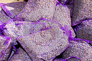 Pouch with lavender in a wooden basket. Fragrant bag of lavender flowers